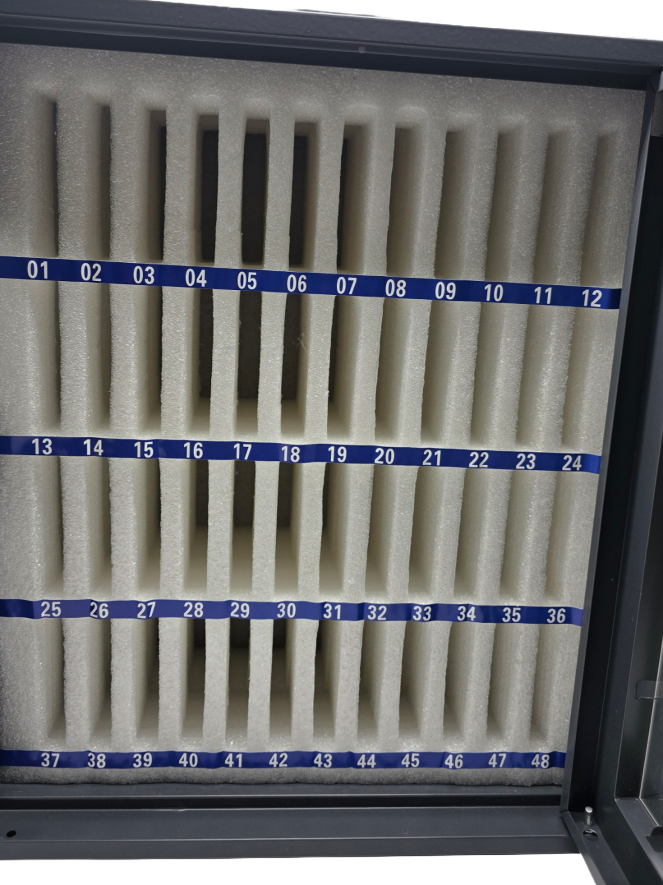 Close-up of numbered EPE foam-lined compartments inside the Safe Pouch Tier 3 phone storage cabinet